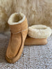 Pair of terra slipper sheepskin minimalist footwear tan