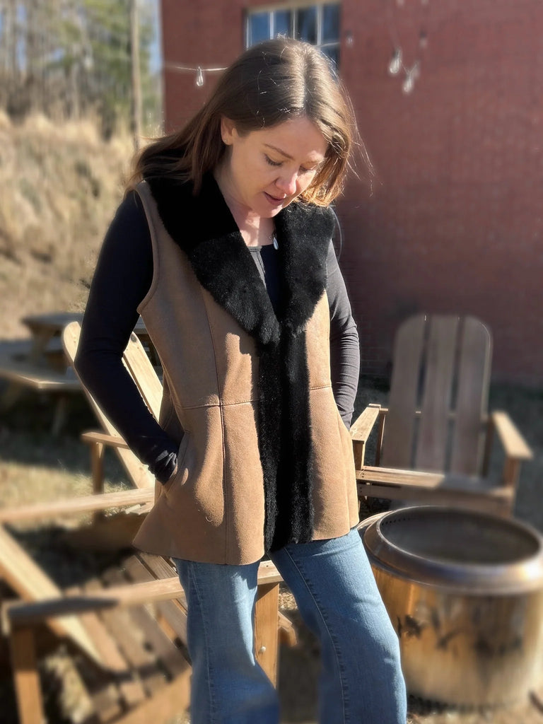 Woman standing in the maven vest